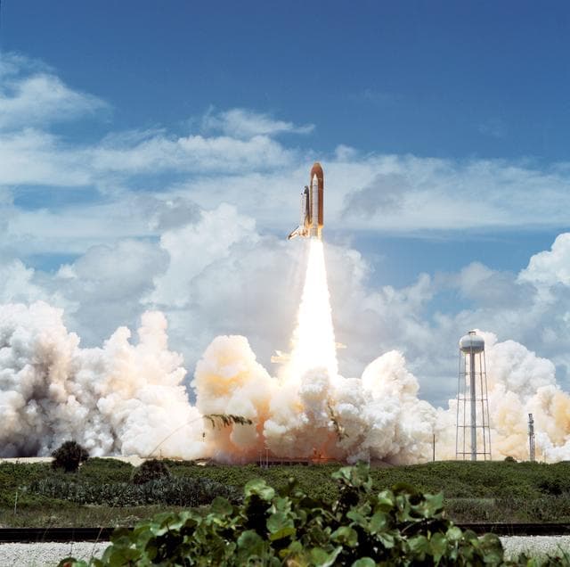 NASA image: STS-65 Columbia, OV-102, clears launch tower after liftoff from KSC LC 39A