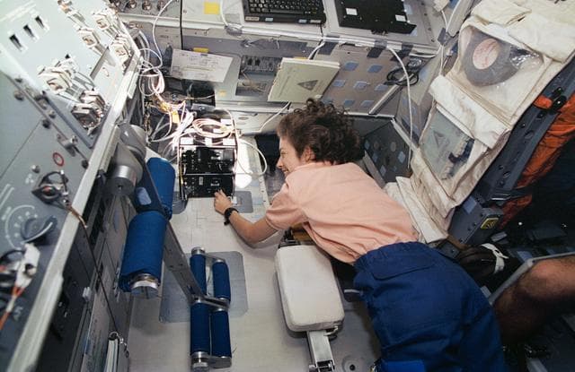 NASA image: Astronaut Ellen Ochoa works with ATMOS experiment checkout