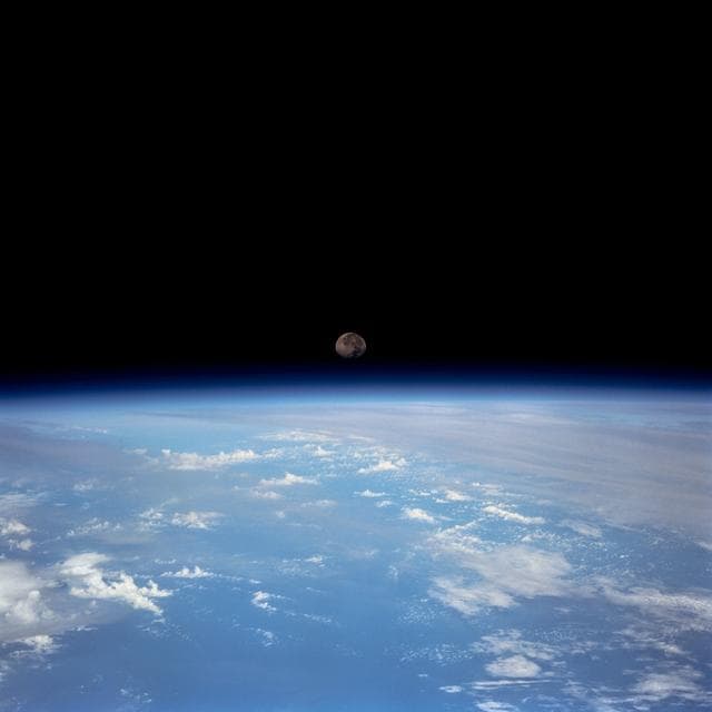 NASA image: Moon set over earth limb