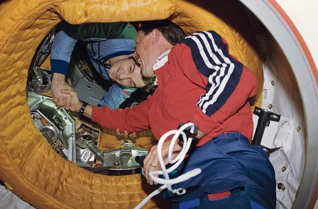 NASA image: Astronaut Gibson and Comonaut Dezhurov shake hands