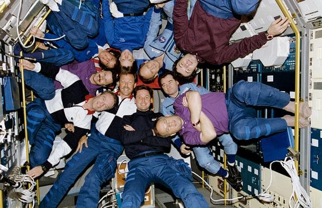 NASA image: STS-71, Mir 18 and Mir 19 crews pose for inflight portrait
