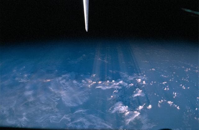 NASA image: Long cloud shadows stretching hundreds of miles