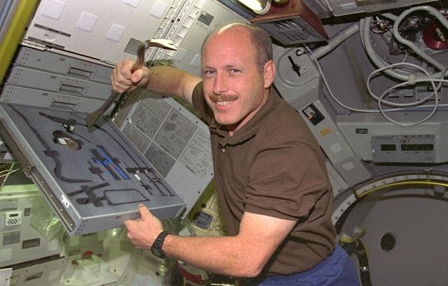 Crewmembers float around in Spacelab