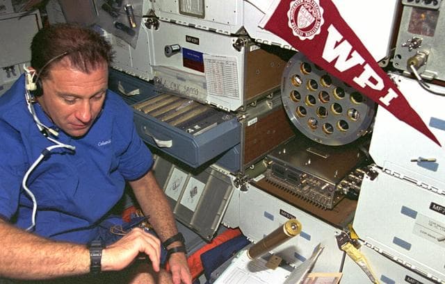 NASA image: ZCG, Payload Specialist Al Sacco loads middeck experiment