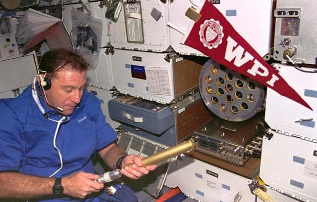 NASA image: ZCG, Payload Specialist Al Sacco loads middeck experiment