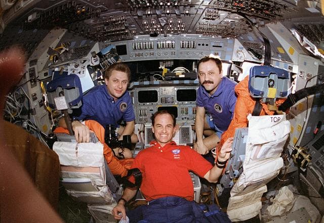 NASA image: Kevin Chilton gives Onufrienko and Usachev a tour of the shuttle flight deck