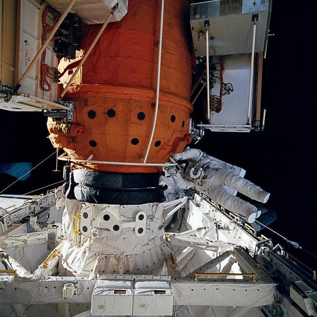 NASA image: Astronauts Linda Godwin and Michael "Rich" Clifford during EVA