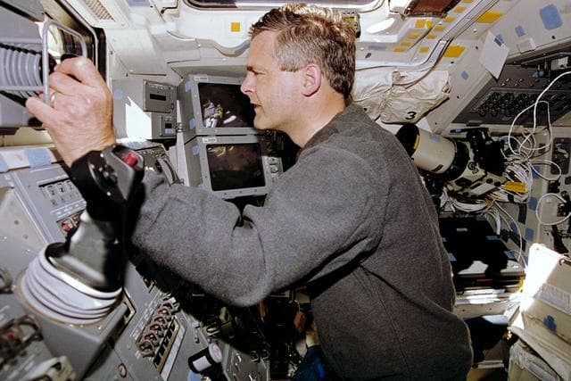 NASA image: STS-77 crewmembers photographed working with RMS controls