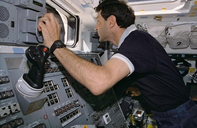 NASA image: STS-77 crewmembers photographed working with RMS controls