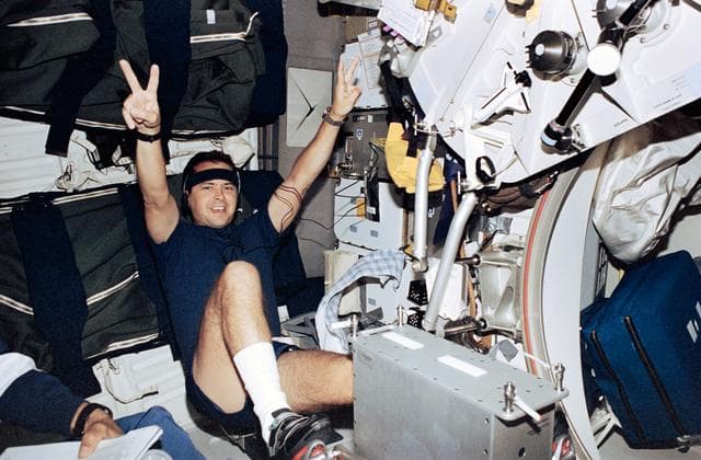 NASA image: Bursch erercises on ergometer on Endeavour's middeck