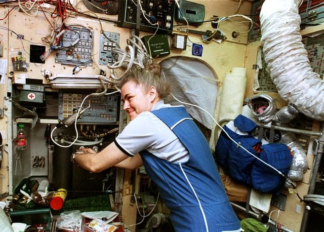 NASA image: STS-79 crew enjoy a meal on the Mir space station