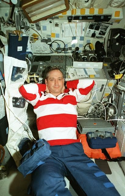 NASA image: Astronauts Akers and Wilcutt relax on the Atlantis flight deck