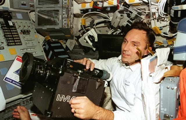 NASA image: Astronaut Walz on flight deck with IMAX camera