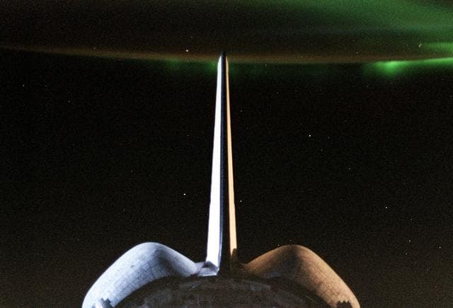 NASA image: Sunrise reflected on the orbiter's vertical stabilizer