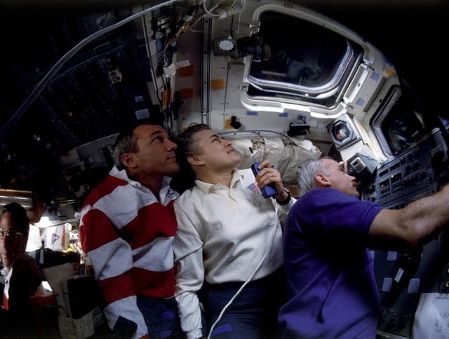 NASA image: STS-79 crew watches from aft flight deck during undocking from Mir