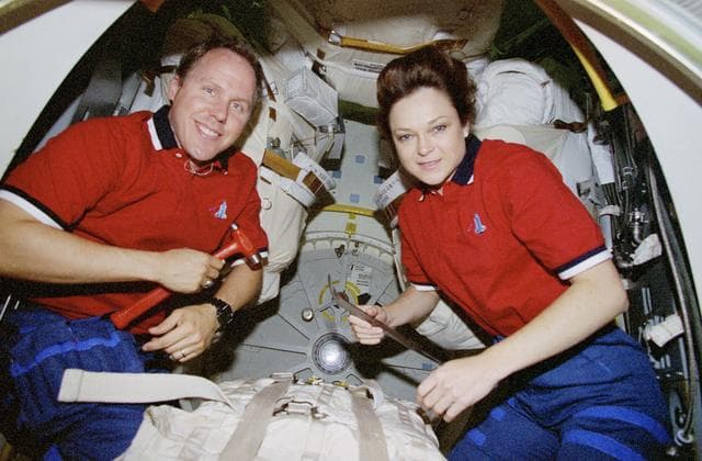 NASA image: Mission Specialists Jones and Jernigan pose for photos in airlock