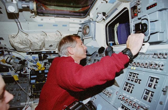 NASA image: Cockrell poses at the aft flight deck station for Rendezvous and Prox-Ops