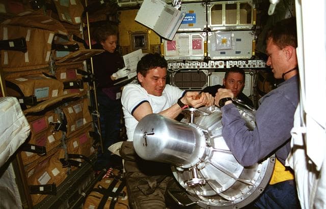 NASA image: Mir 22 and STS-81 crew work with gyrodyne