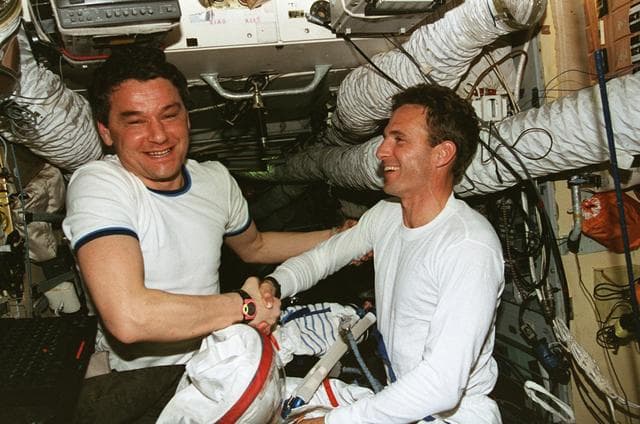 NASA image: MS Linenger performs suits check on Russian pressure suit
