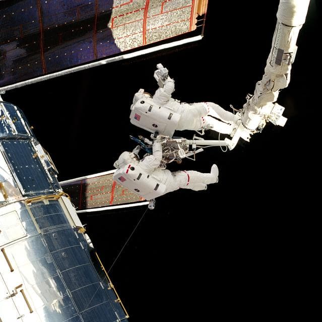 NASA image: EVA 2 activity on Flight Day 5 to survey the HST solar array panels