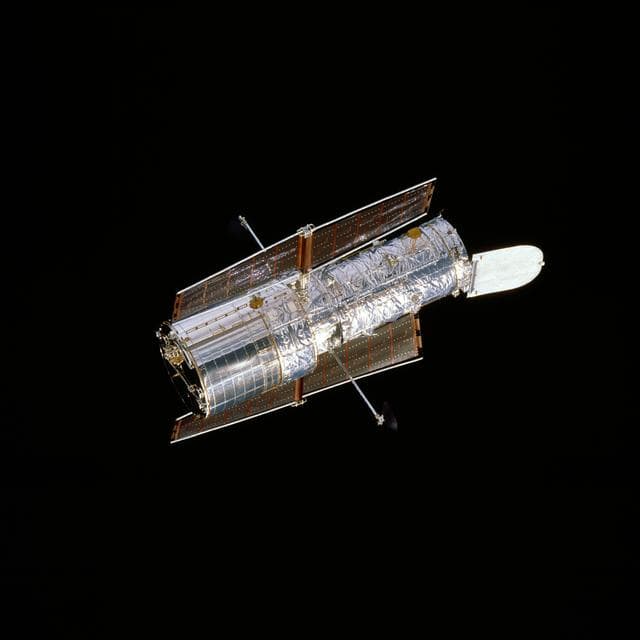 NASA image: HST, flyaround of the telescope after deployment on this second servicing mission