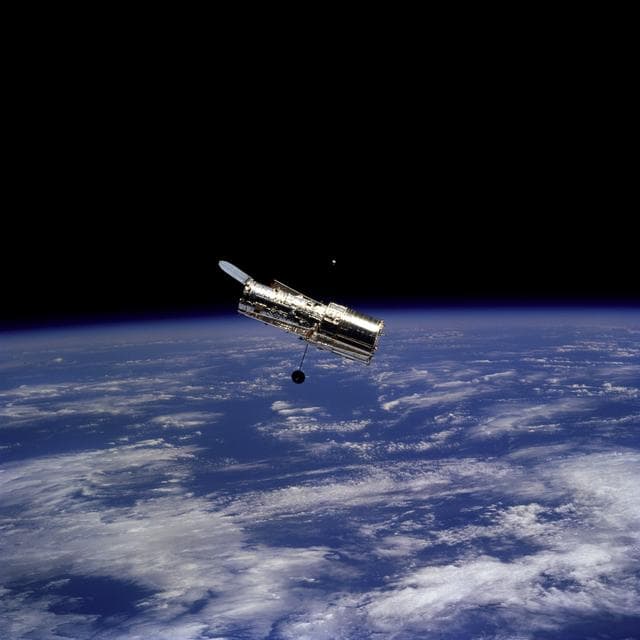 NASA image: HST, flyaround of the telescope after deployment on this second servicing mission