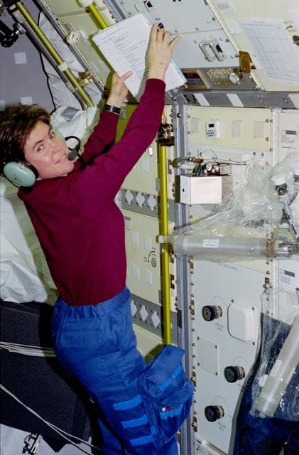 NASA image: LIF - Payload commander Voss in front of experiment rack