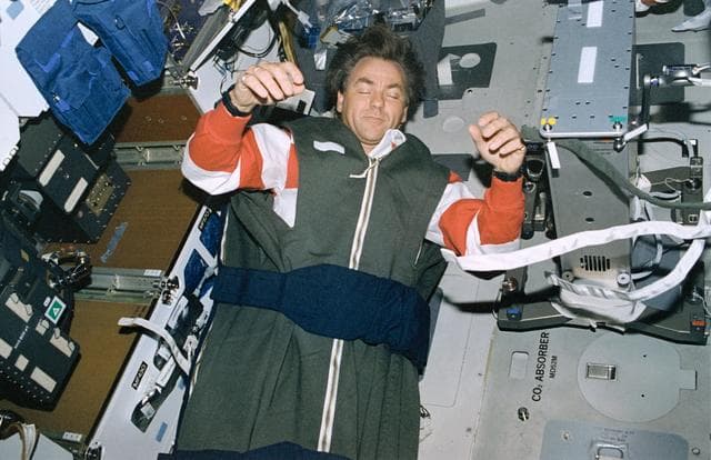NASA image: Crewmembers sleeping in sleep restraints