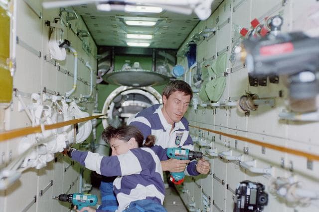 NASA image: View of the STS-88 crew at work in the FGB/Zarya module