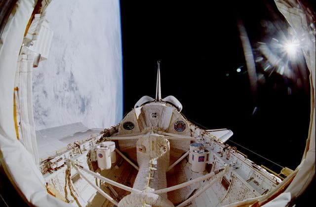 NASA image: Fish-eye view of the STS-90 Columbia's payload bay with sunburst