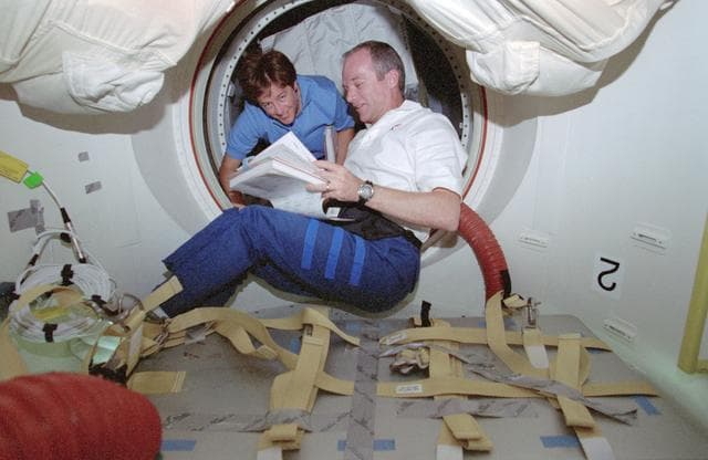 NASA image: Crewmember activity in the middeck including a meal