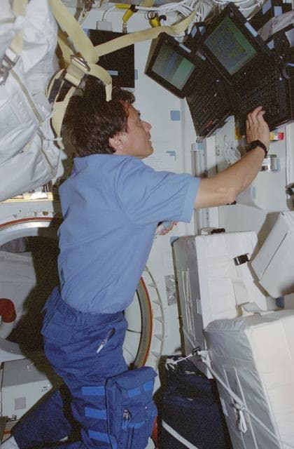 NASA image: AMS,Chang-Diaz works with computers in the middeck