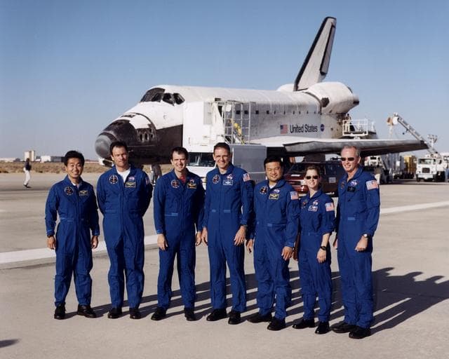 NASA image: STS-92 crew poses outside shuttle after landing at Edwards