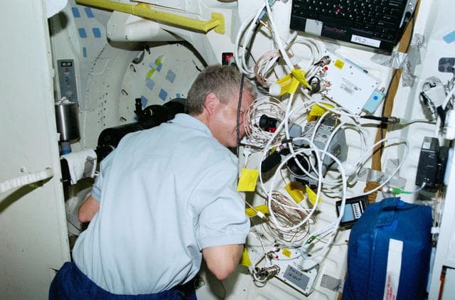 NASA image: Mission Specialist Hawley works with the SWUIS experiment