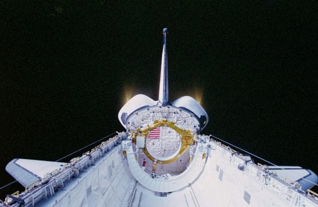 NASA image: A view of the Columbia's OMS engine pods during a burn