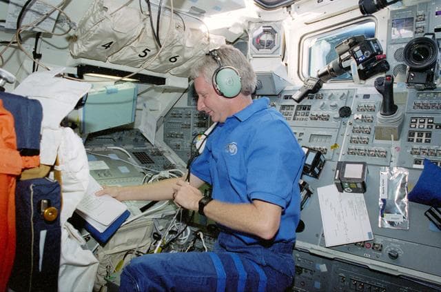 NASA image: STS-93 MS Hawley works with the SAREX II equipment on the flight deck