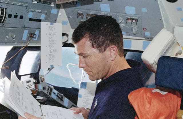 NASA image: Rick Husband at his station on the forward flight deck