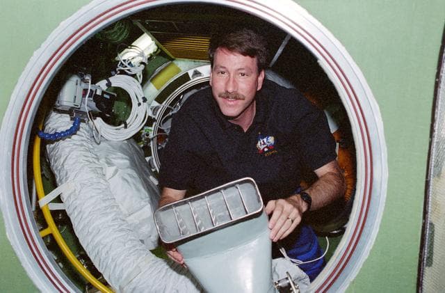 NASA image: Kent Rominger holds a ventilation duct