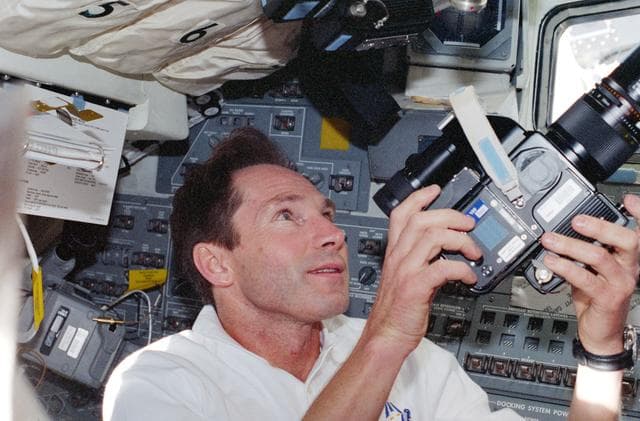 NASA image: Valeri Tokarev on aft flight deck with camera