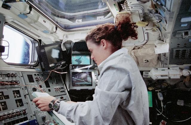 NASA image: Julie Payette at RMS controls on aft flight deck