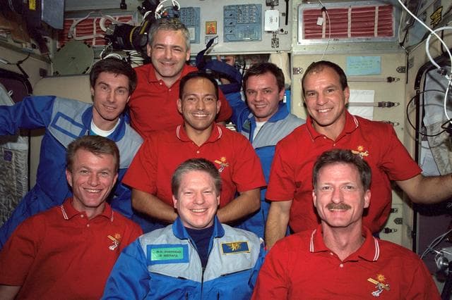 NASA image: STS-97 and Expedition One crewmembers pose for a photo in the Service Module