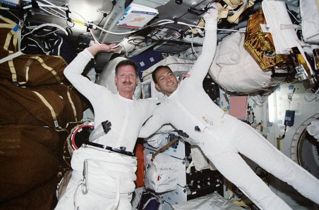 NASA image: MS Tanner and MS Noriega pose in LCVGs prior to the third EVA of STS-97