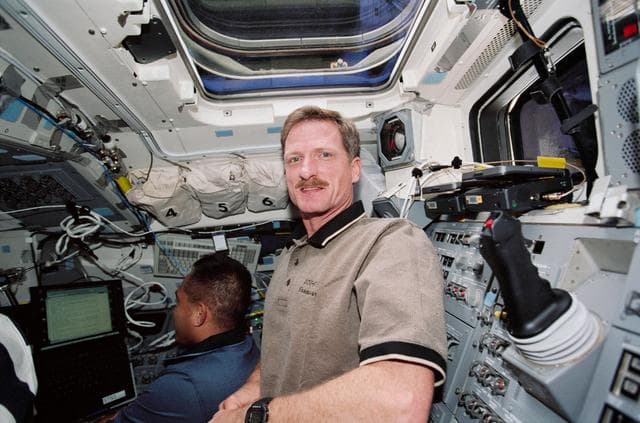 NASA image: MS Tanner and MS Noriega work on the aft flight deck during STS-97