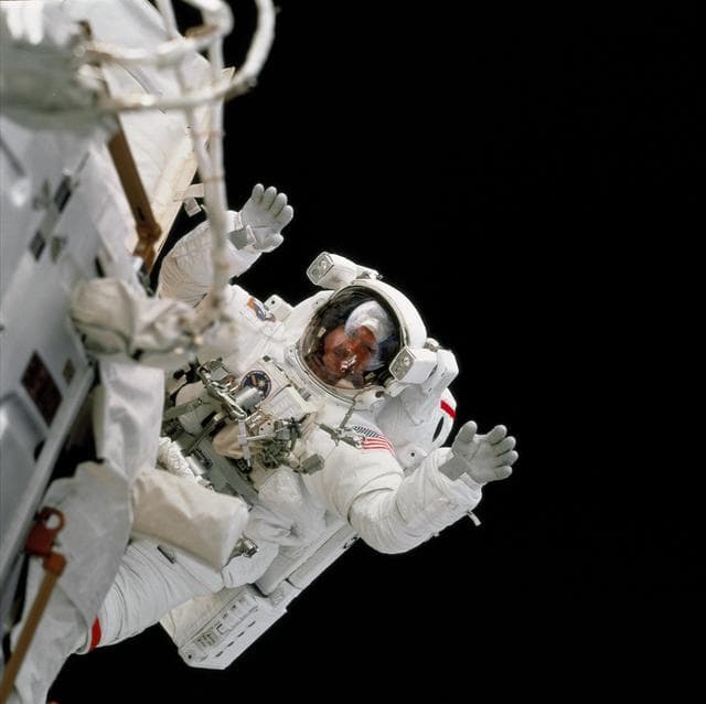 NASA image: View of MS Tanner waves to the camera during the third EVA of STS-97