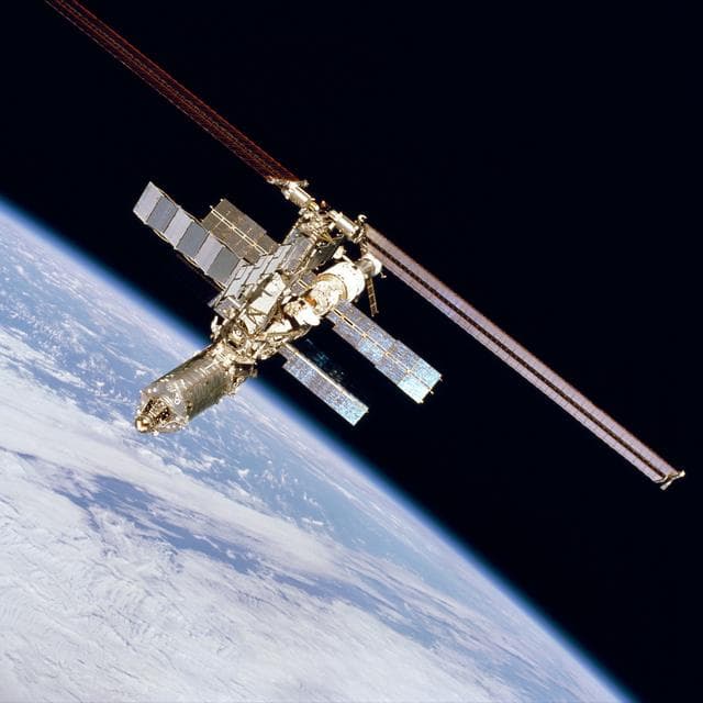 NASA image: Forward zenith view of ISS over Earth limb taken during fly-around