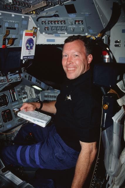 NASA image: STS-99 Pilot Dominic Gorie works on OV-105's flight deck
