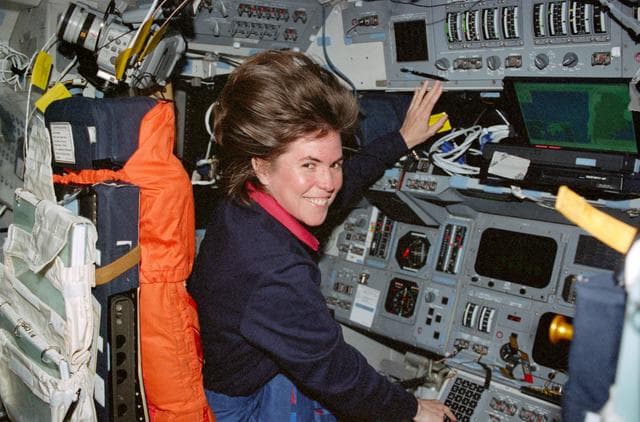 NASA image: STS-99 MS Voss works at the commander's workstation on OV-105's flight deck