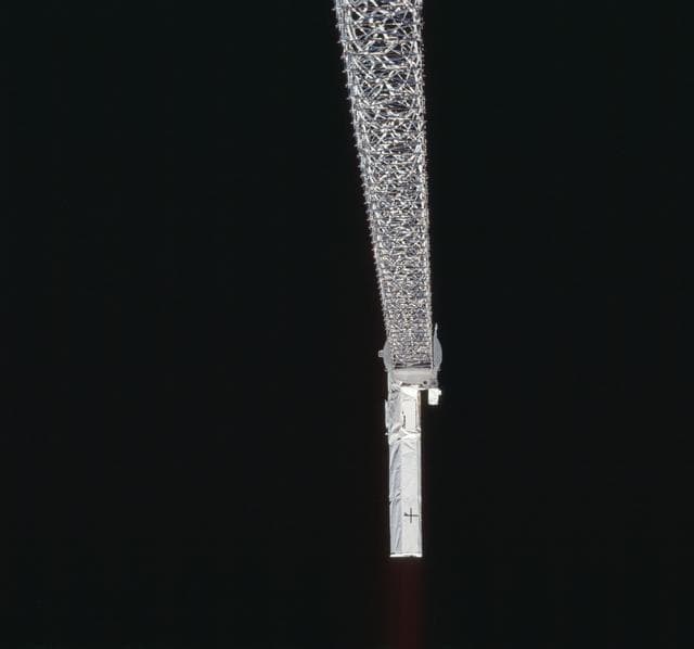 NASA image: A view of the SRTM's 200 ft. boom deployed from OV-105 during STS-99