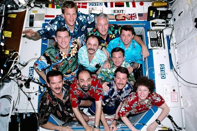 NASA image: The STS-100 and Expedition Two crews pose for a group photo in the U.S. Laboratory