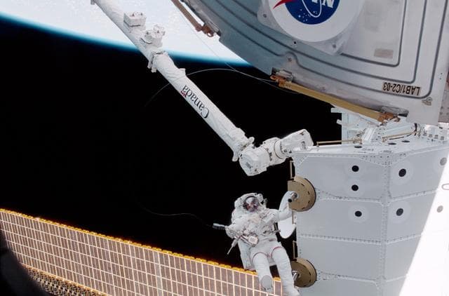 NASA image: MS Hadfield works on the SLP during an EVA for STS-100